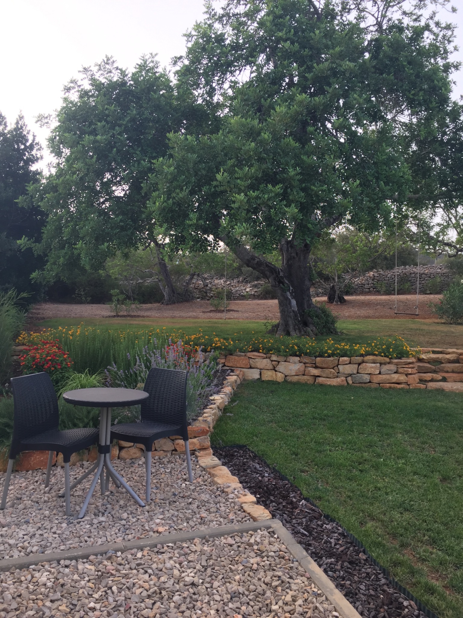 Mature garden and stone walls